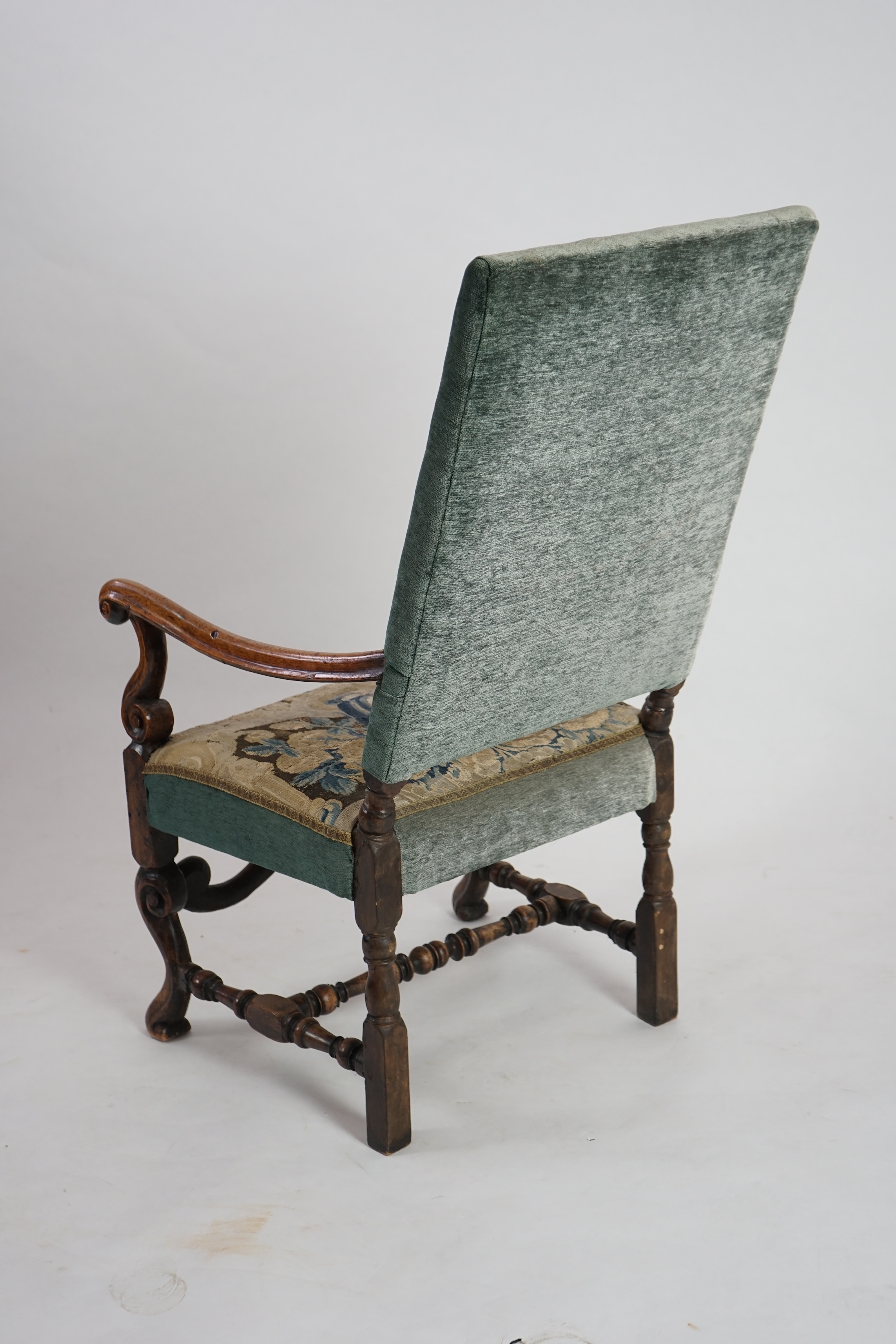 A Louis XV walnut fauteuil tapestry seated armchair